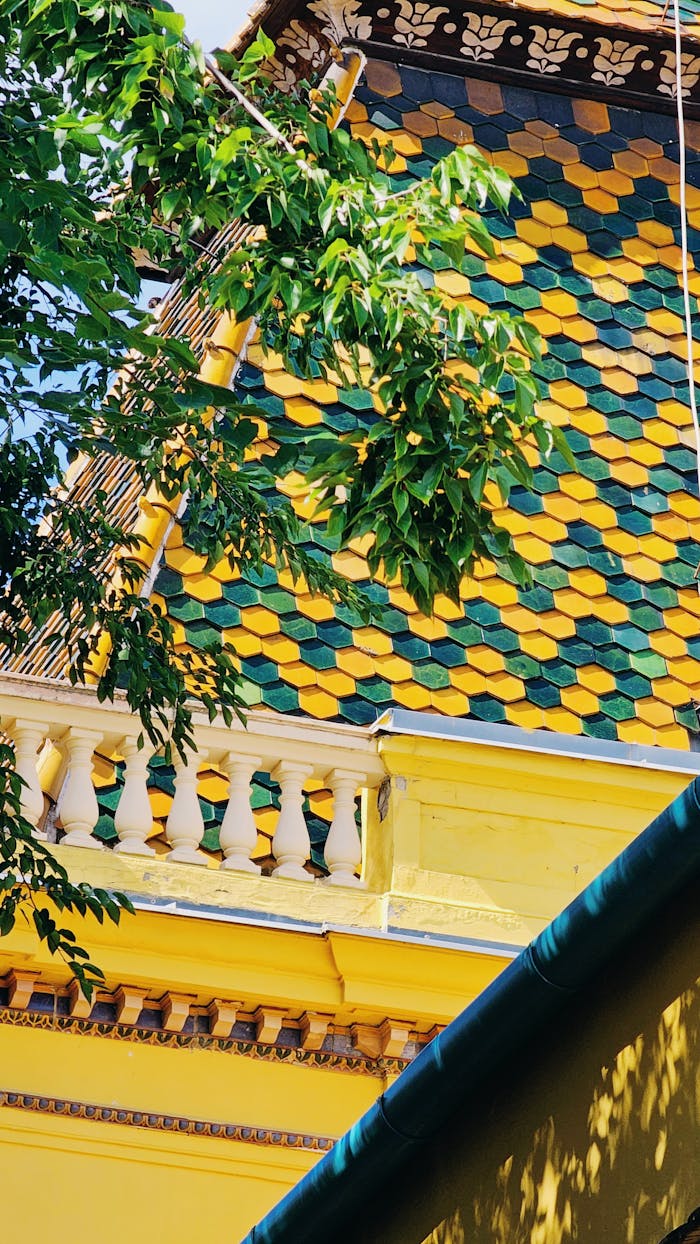 A close-up of the colorful Zsolnay tiled roof in Pécs, showcasing intricate architectural design.